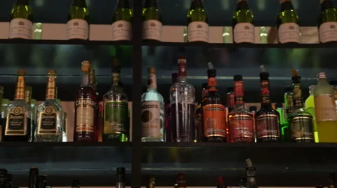 Liquor Bottles On Bar Shelf Stock Footage 60052742