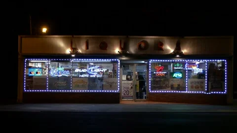 Liquor store customer exits store, late night hours Video stock 246880692