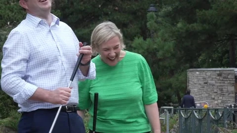Lisa Smart plays mini golf at Lib Dem party conference Stock Footage 317450532