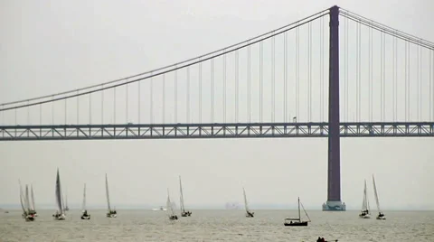 Lisbon bridge sailboats Stock Footage 32007992