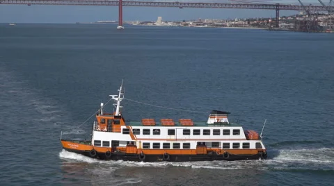 Lisbon Cacilhas ferry with bridge behind Tegus River, Portugal Stock Footage 64151109