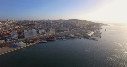 Lisbon fly in from river tejo. Cais do sodre train station Stock Footage 91221585