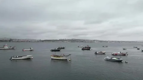 Lisbon Harbor Boats Under a Cloudy Sky: A Serene River View Stock Footage 310613372