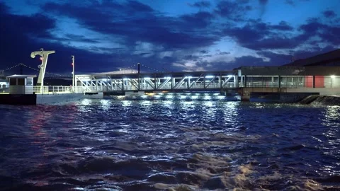 Lisbon harbour ferry docks at night in rough sea Stock Footage 273075016
