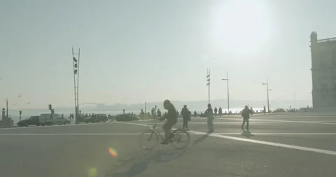 Lisbon Lockdown - Cyclist in Main Square Praça do Comércio Stock Footage 147199460