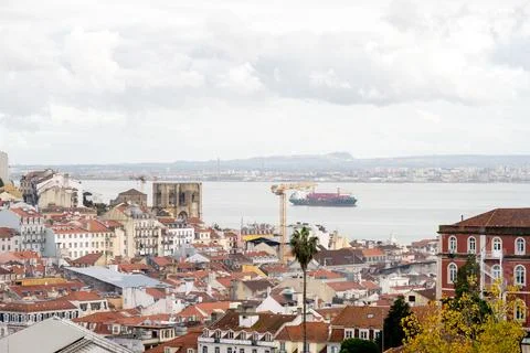 Lisbon old town rooftops with hillside castle view Stock Photos