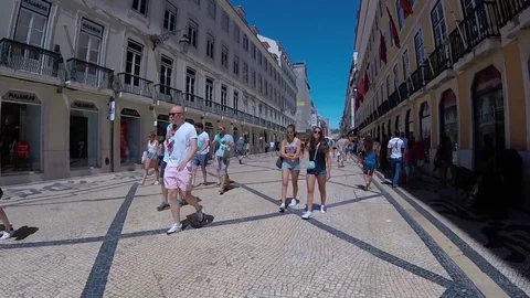 LISBON, PORTUGAL - AUGUST 18, 2017: tourists walking in center of the city Stock Footage