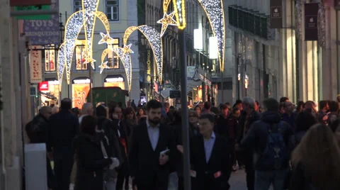 Lisbon Portugal Crowds of People walking through city centre in Winter Stock Footage 59592546