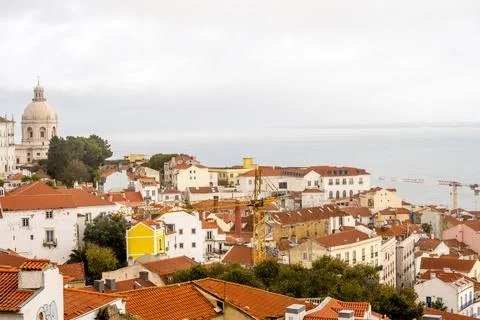 Lisbon rooftops with dome and construction crane Foto stock