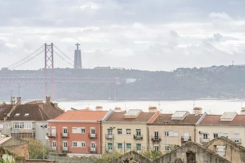Lisbon rooftops with Tagus River bridge and Cristo Rei 스톡 사진