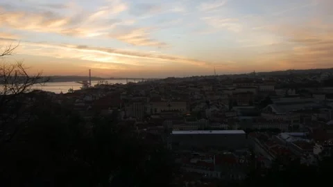 Lisbon sunset timelapse showing Baixa district and 25 April Bridge, Portugal Stock Footage 168236401