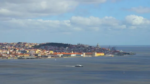Lisbon Timelapse Lisboa seen across water clouds passing Baixa Stock Footage 315703246
