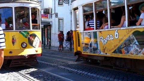Lisbon tram two trams passing each other Stock Footage 105054794