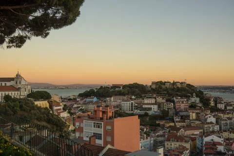 Lisbon viewpoint sunset over rooftops Stock Photos