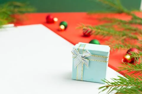 A list of Christmas wishes next to several small gifts Stock Photos
