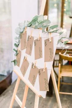 List, plan, chart of the seating area of guests at the tables at restaurant tent Stock Photos
