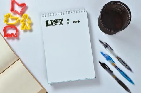 List text on notepad with office accessories. Business motivation, inspiratio Stock Photos