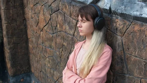Listen music with bad mood. Stock Footage 252151939