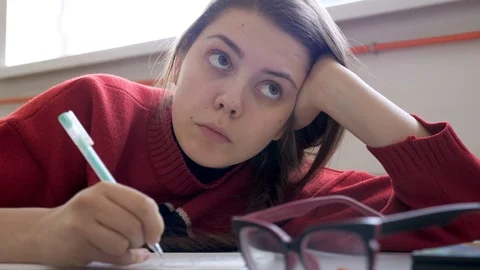 Listening and making notes concept. Exam preparation. Student making notes Vidéo 103394904