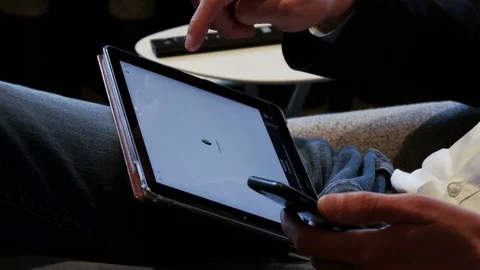 Listening to music on tablet computer 4 K Stock Footage 76084785