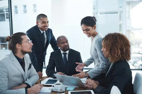 Listening to their values and inputs. a group of businesspeople discussing Foto stock