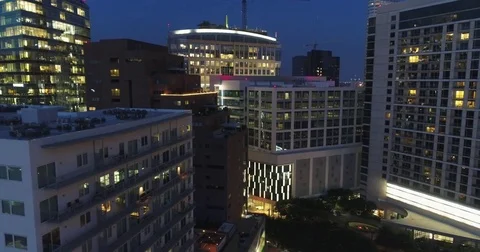 Lit Apartment Blocks and Rooftop Terraces in Nighttime Dallas Stock-Footage 79874317