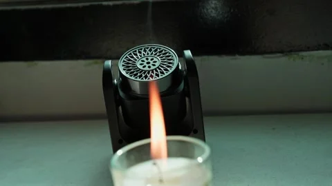 Lit Candle And Electronic Aroma Diffuser Emitting Vapor Stock Footage 346055003
