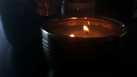 Lit Candle in Dark Room with Focus Change Vídeo Stock 100524672