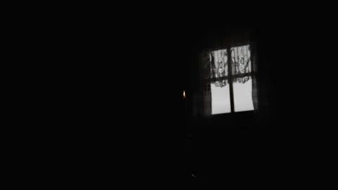 Lit Candle in a Dark Room Stock Footage 300491204