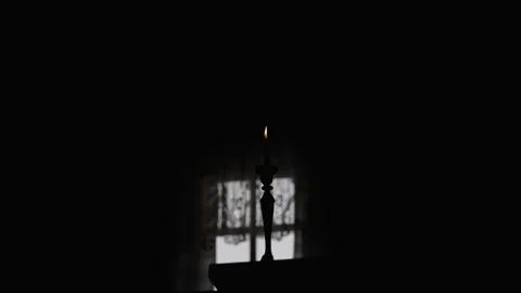Lit Candle in a Dark Room Stock Footage 300491228