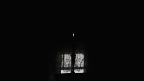 Lit Candle in a Dark Room Stock Footage 300491232
