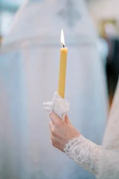 Lit Candle Held During Religious Ceremony at Church of St Tikhon Foto stock