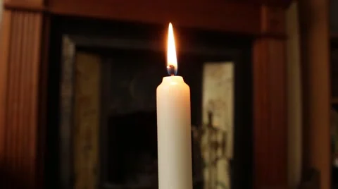 Lit candle slowly moves on a fixed point Stock Footage 58971488