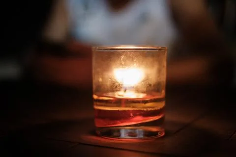 Lit Candle in Small Cup Stock Photos