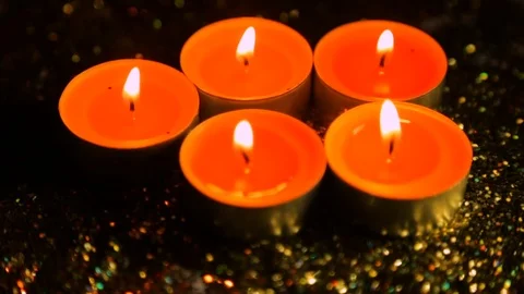 The lit candles against the background of gloss in degradation Stock-Footage 83138788