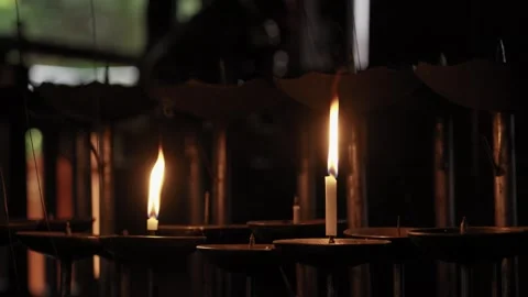 Lit Candles Burning In Dark Temple Interior Japan Vídeo Stock 340595044