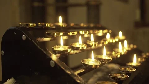 Lit candles in church Stock Footage 133459737