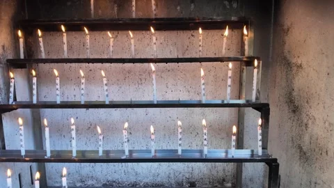Lit Candles Inside Temple for Prayer and Meditation Stock Footage 327882157