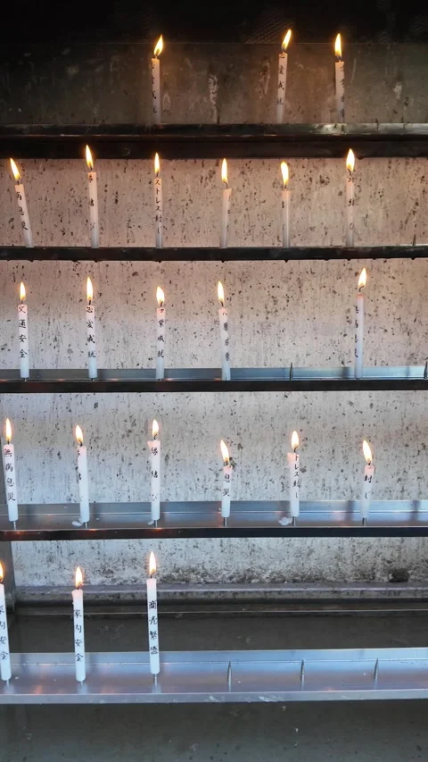 Lit Candles Inside Temple for Prayer and Meditation Stock Footage 327883033