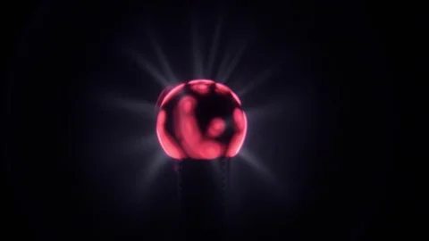 Lit eletric tesla coil ball, with blue energy light rays moving Stock Footage 78836357