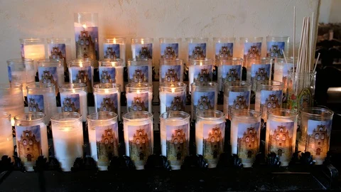 Lit flickering candles inside Mission Espada Video stock 127641671