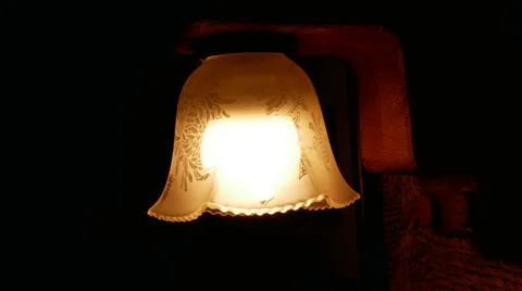 Lit Lamp with a Dark Background Stock-Fotos