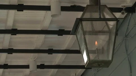 Lit lantern hanging from the ceiling Stock Footage 84508872