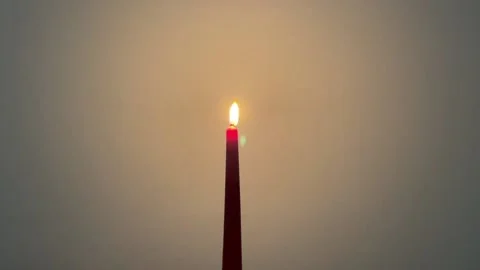 Lit red candle burning Stock-Footage 221482596