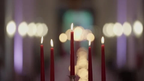 Lit Red Taper Candles on Candelabra with Warm Bokeh Stock Footage 342762427