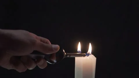 Lit three candles on a dark background 4K Stock Footage 101079974