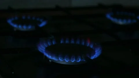Lit three gas burners on the kitchen stove. Stock Footage 238024722