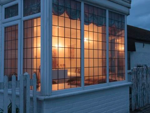 Lit window at night Stock Photos