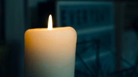 Lit a yellow candle Stock Footage 87586296