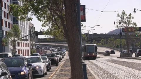 Lite rail train passes traffic Video stock 49126212